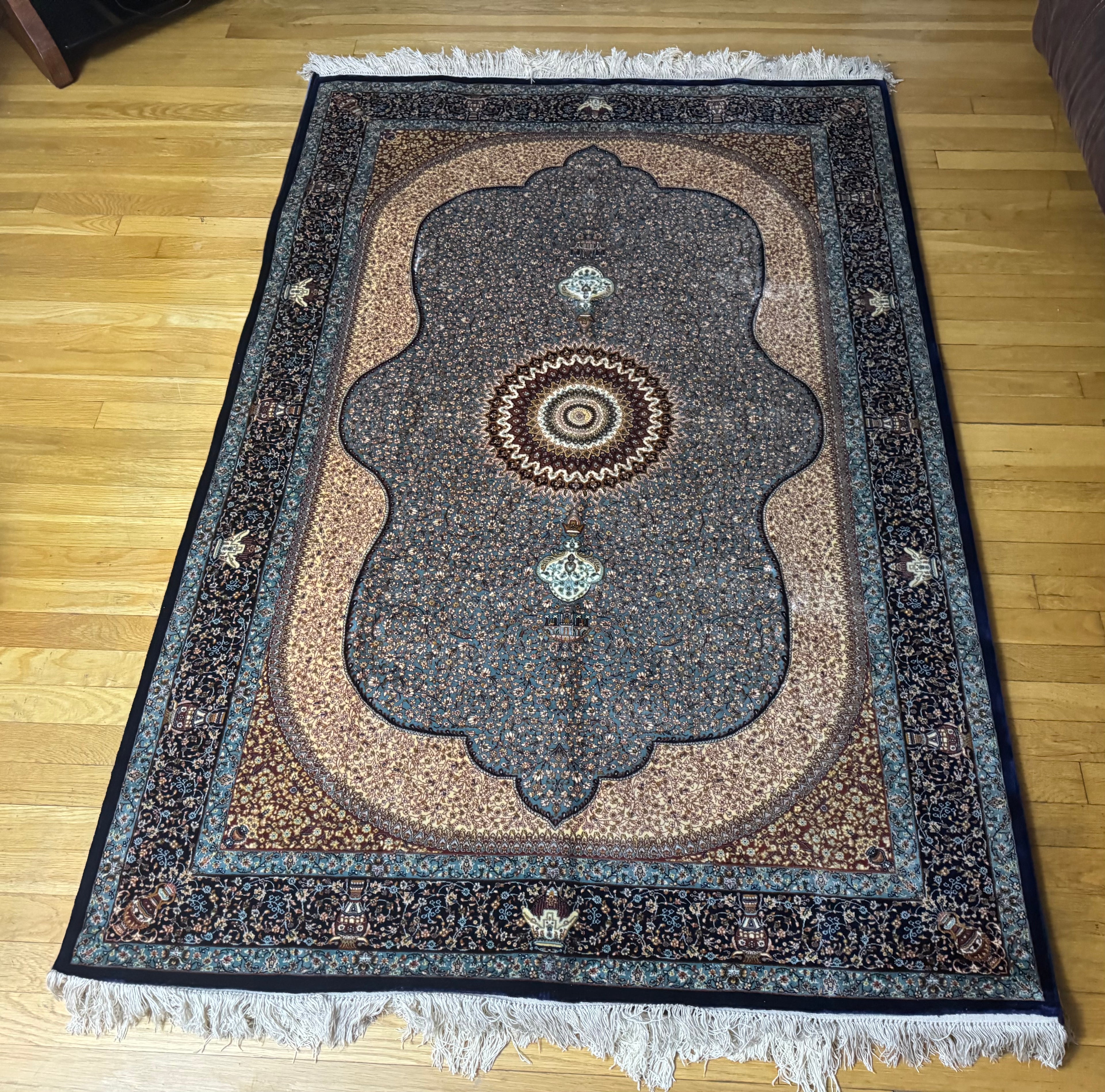 Decorative silk rug with intricate patterns 